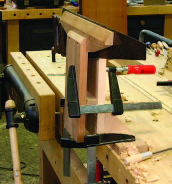 Three clamps. Two F-style clamps hold the vise to the bench, the third 