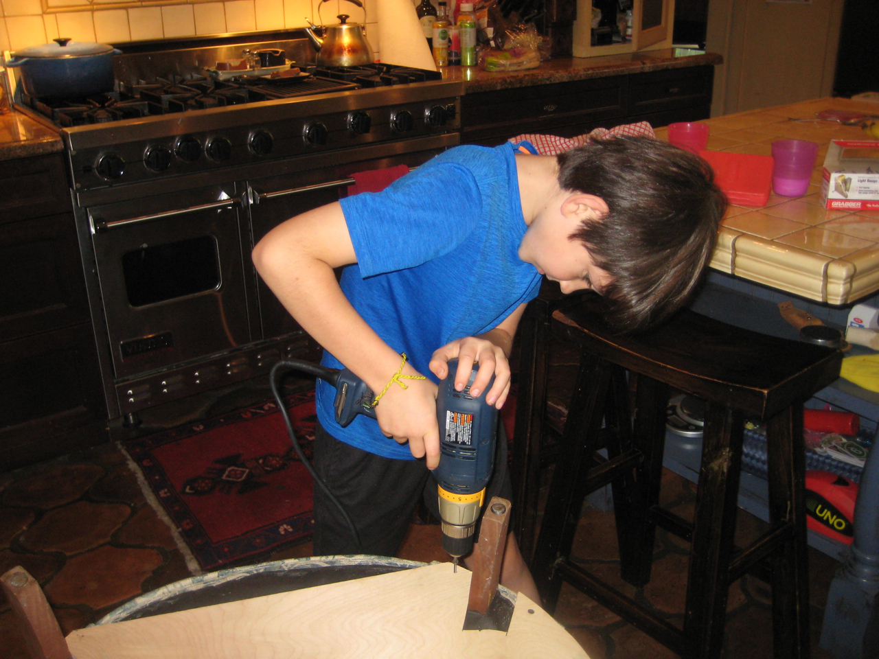 Bob Flexner (assisted by his grandson) repair an upholstered chair the quick and dirty way.