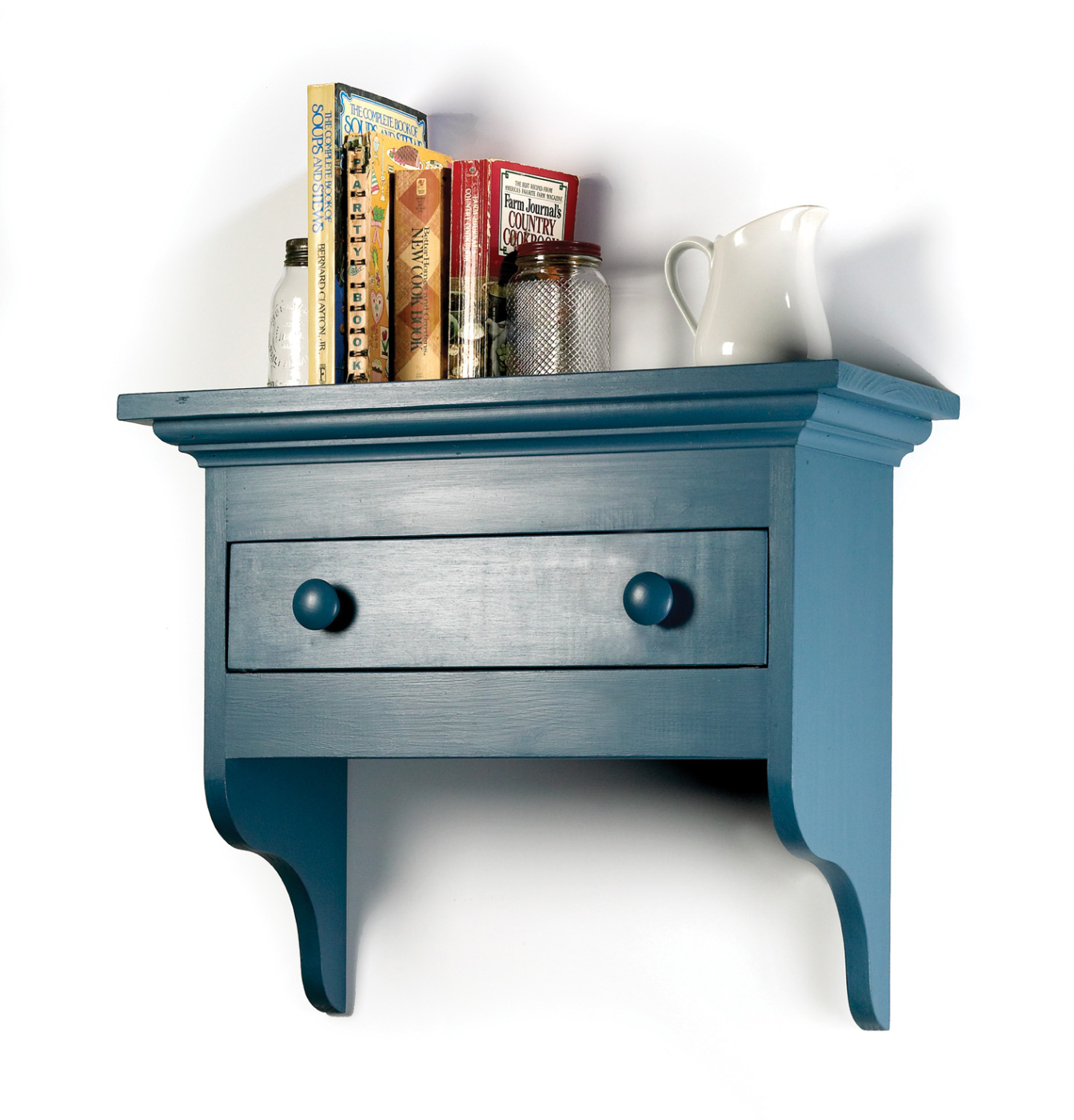 The mouldings dress up the shelf while building the drawer increases your skills.