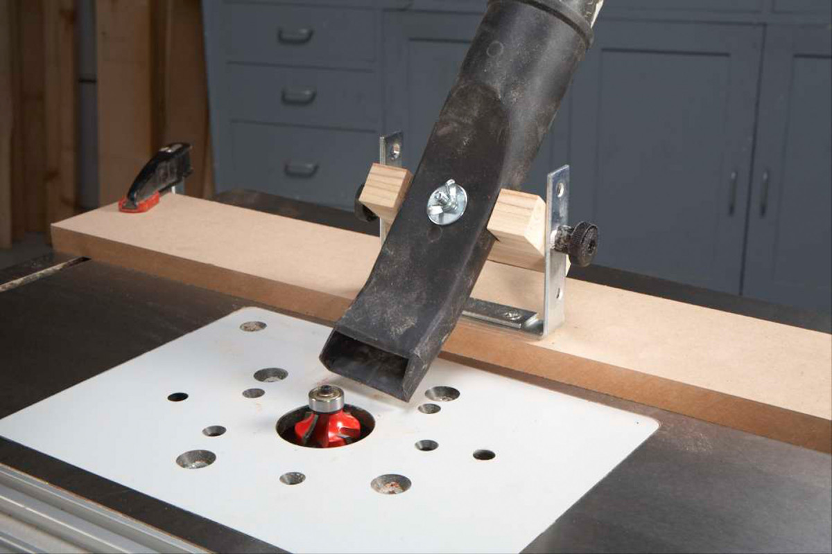 Dust is a real problem when you can’t use a router table’s fence and its dustport. Here's a clever way to suck up that dust using your shop vacuum's nozzle.