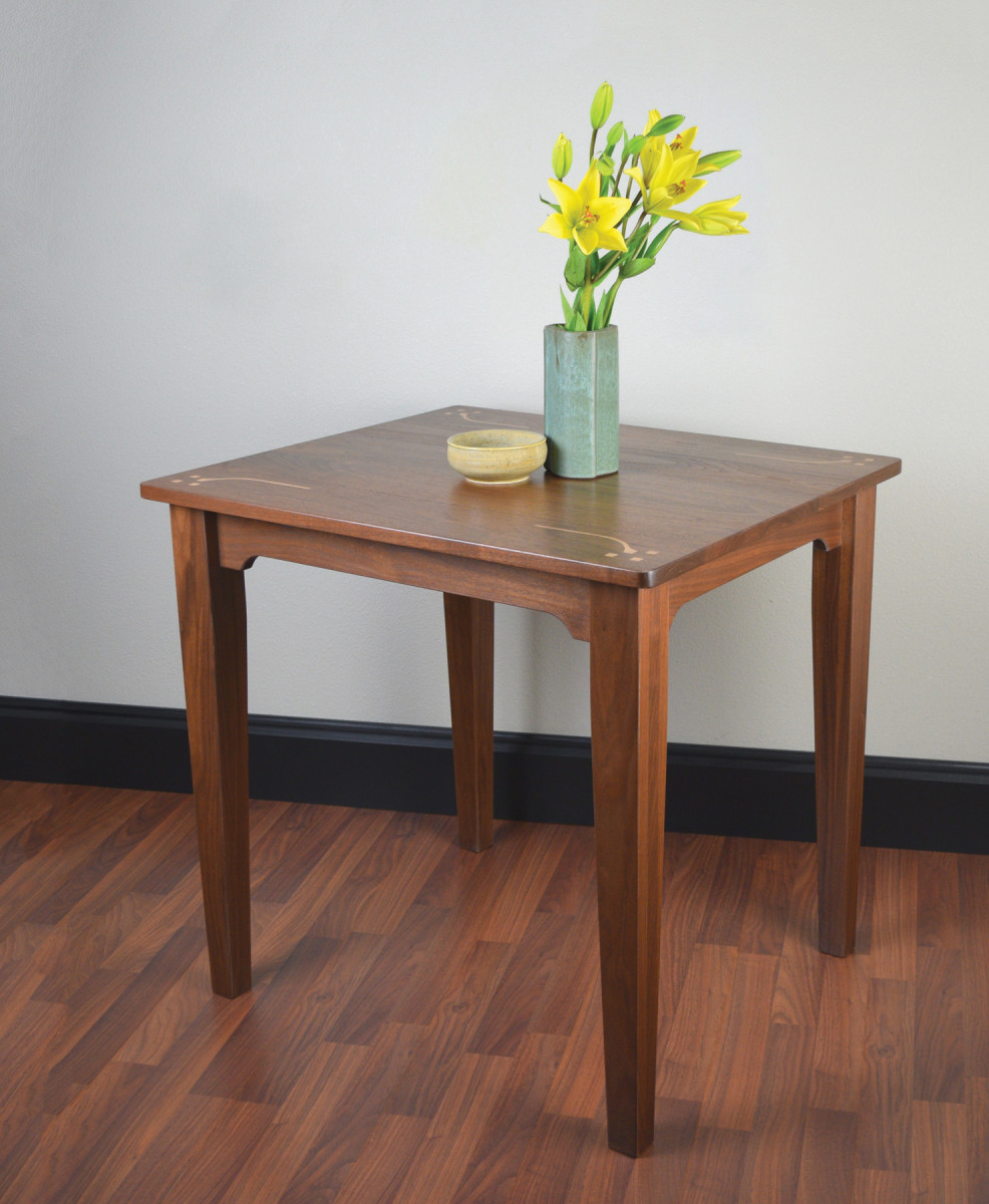 This walnut table features simple router inlay and can be easily built during a long weekend.