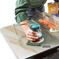 Turn on the sander and exert just enough pressure to keep the pad in place.The rust should be gone in a matter of seconds.