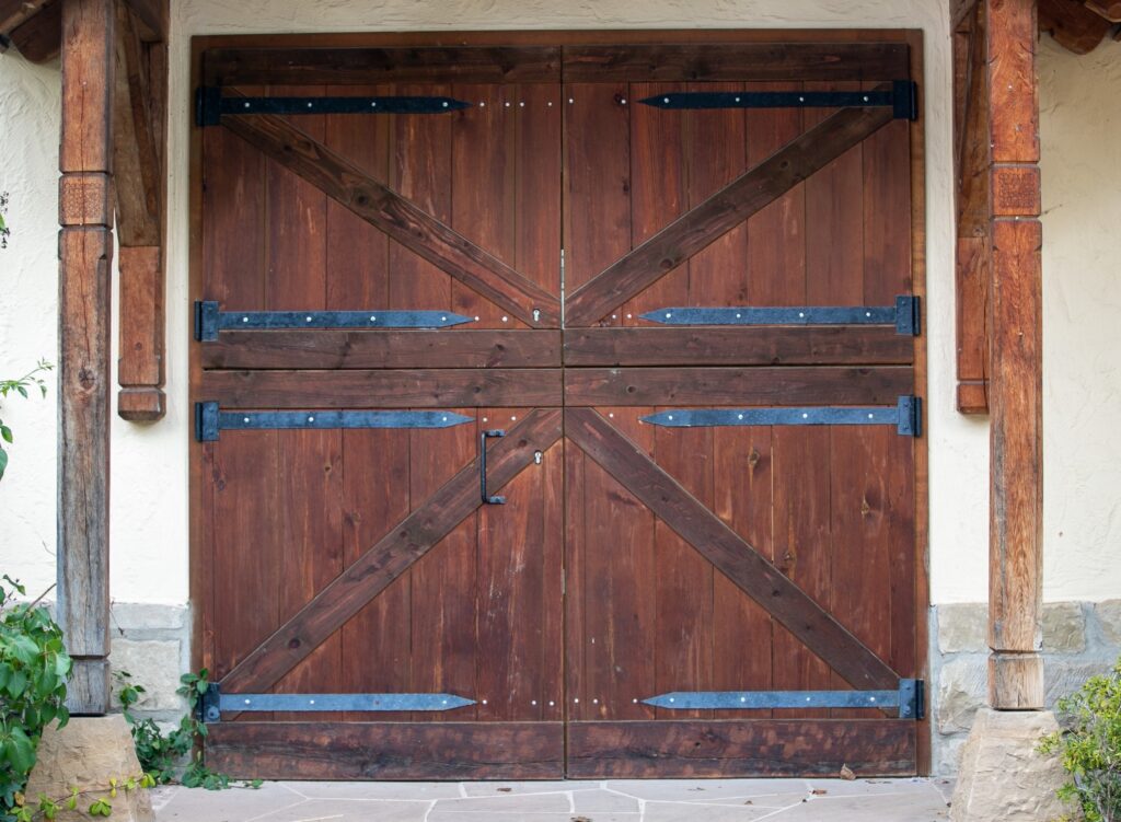 A farmhouse-style barn door on a home
