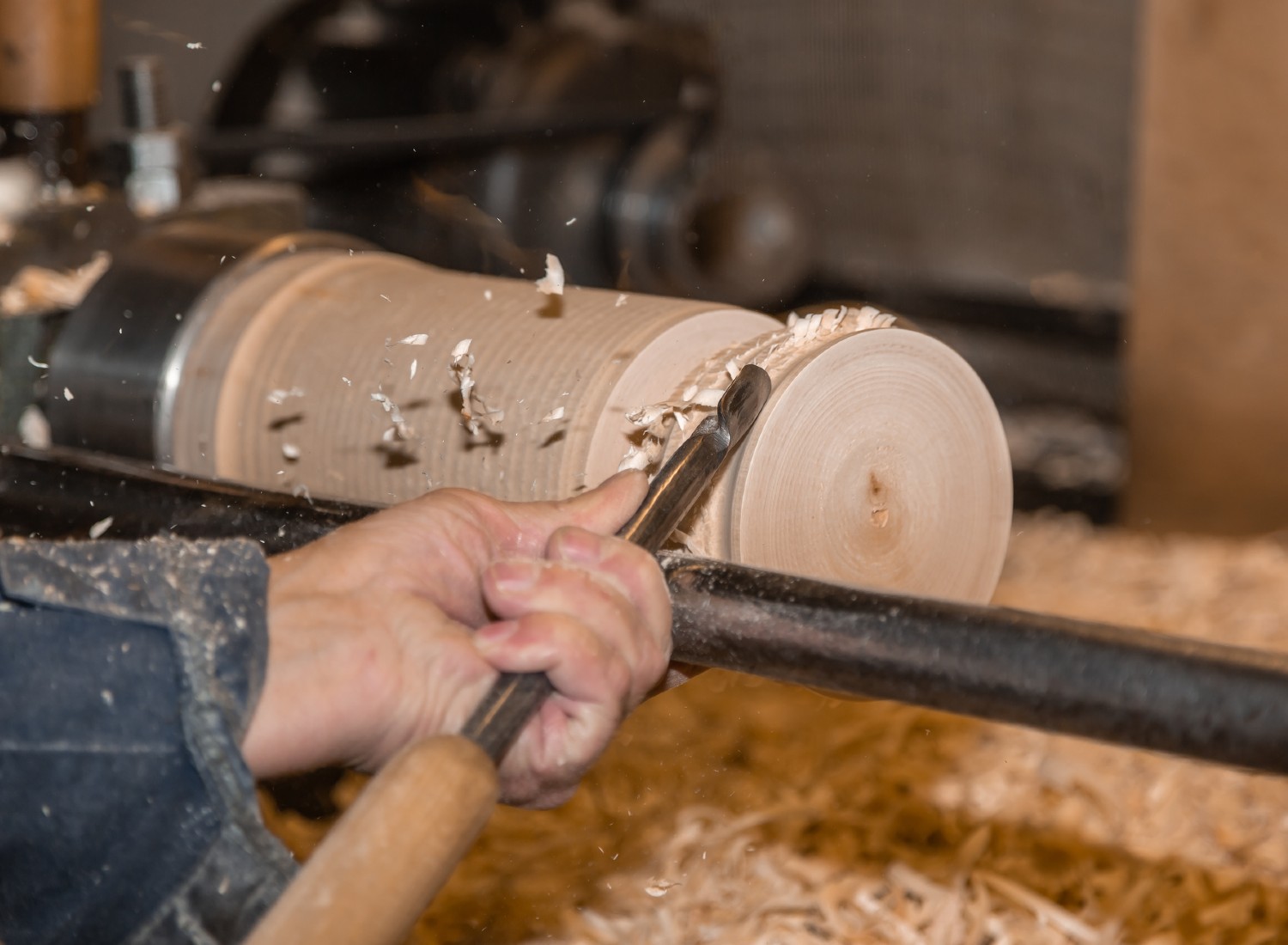 Man working with a wood lathe