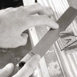 A Japanese flush-cutting saw is a marvel at cleaning up these wedged joints. Use light sawing pressure and work around all sides of the joint to keep the saw cutting true.