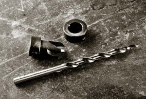 An all-in-one countersink consists of these three parts: a drill bit, countersink and stop.