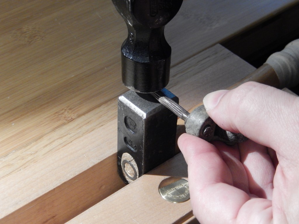 Here you can see how my French/German Joiner's hammer can be used as a makeshift anvil when clamped in a vise. 