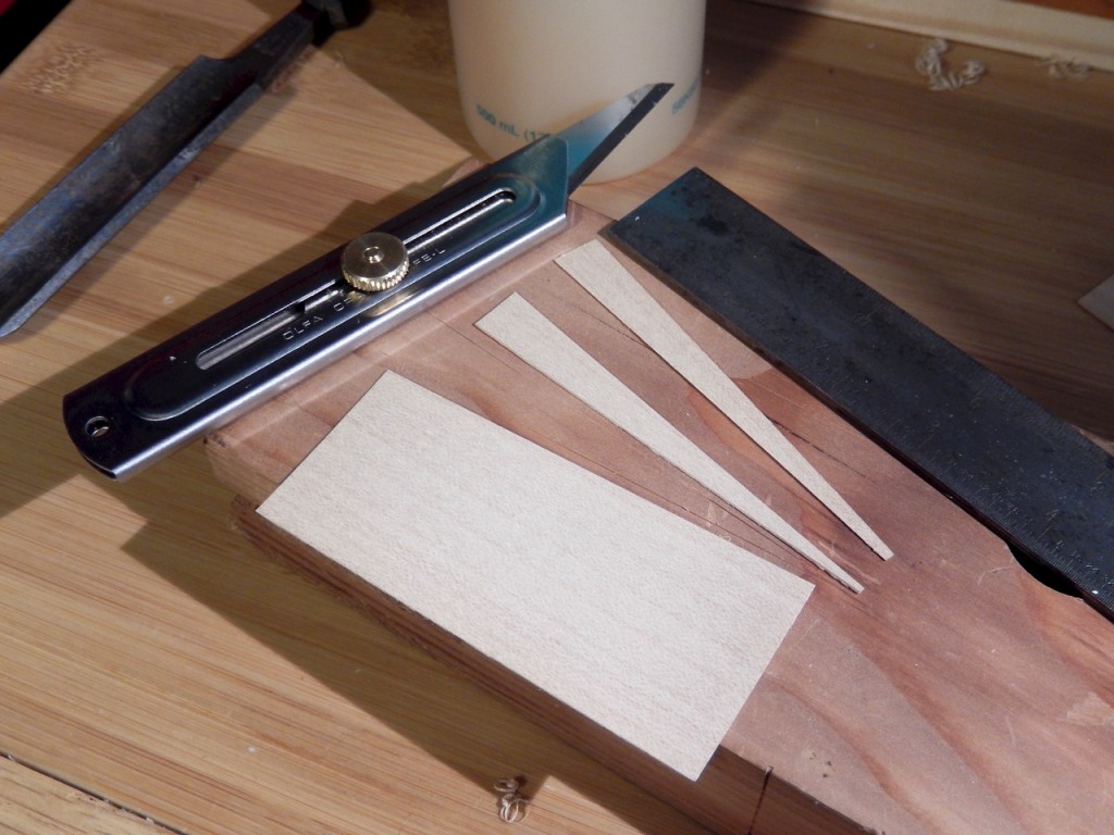 Cutting the shims form a small piece of veneer