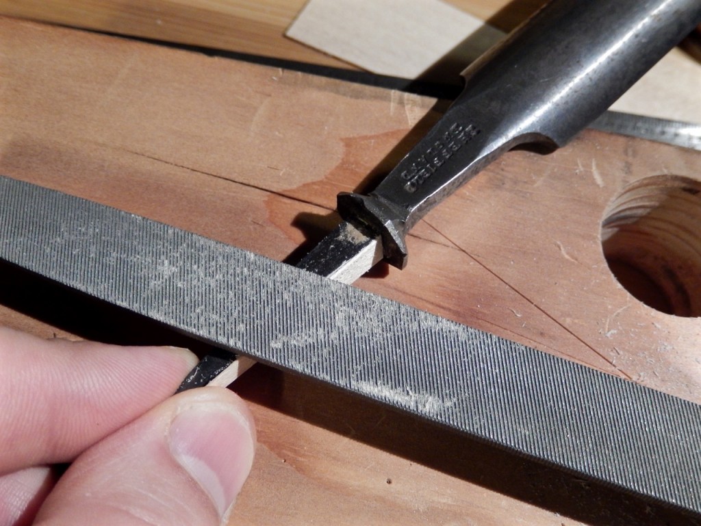 FIle the first shim flush with the tang before gluing the adjacent shim