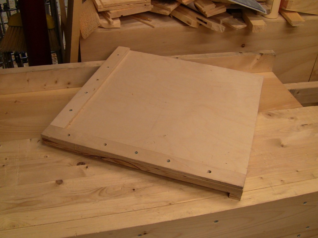  A square planing board, bench hook style.