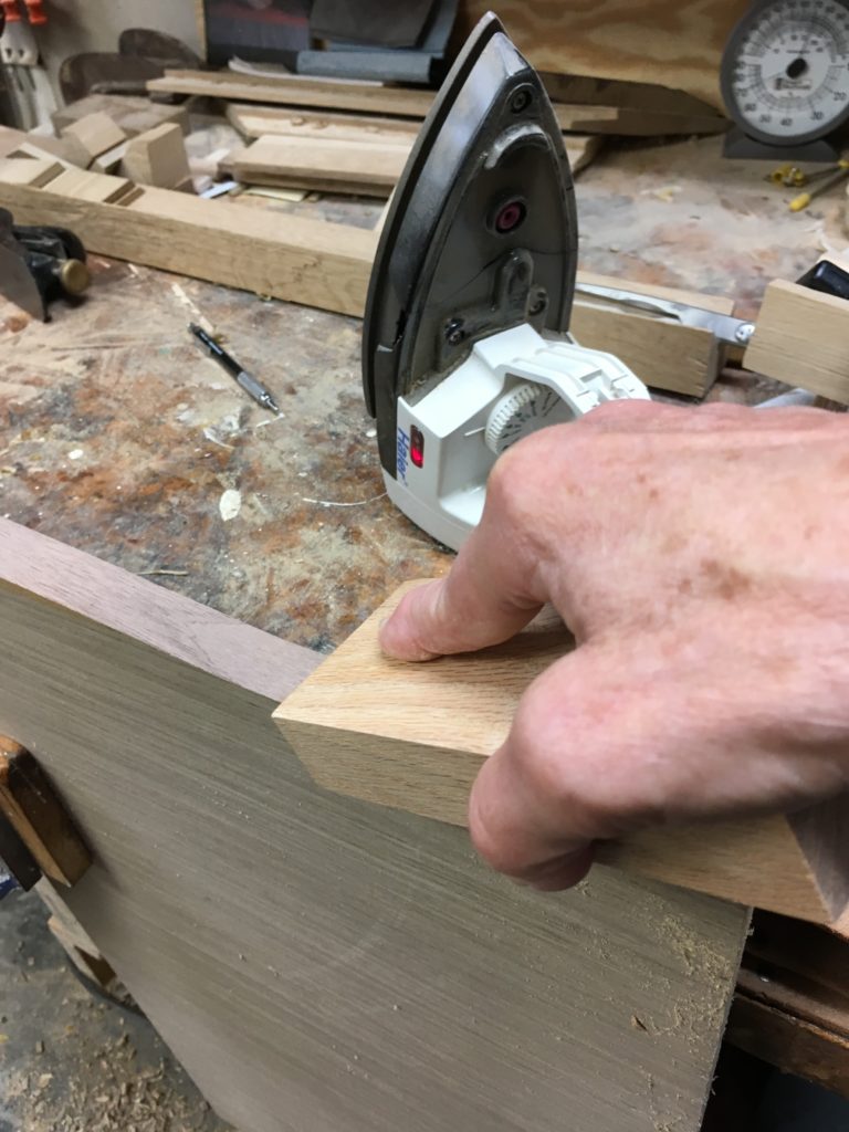 edge banding architectural veneer in a small shop