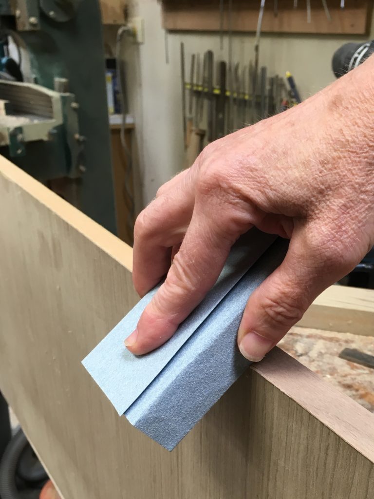 edge banding architectural veneer in a small shop