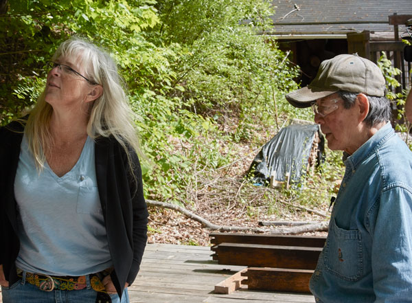 I think I was asking Toshio here how he was going to get a massive crossbeam onto tenons 10' (maybe 12') up. He just shrugged and smiled. But before we left, it was firmly in place. Magic! (Or some young, strong arms and a tripod.)