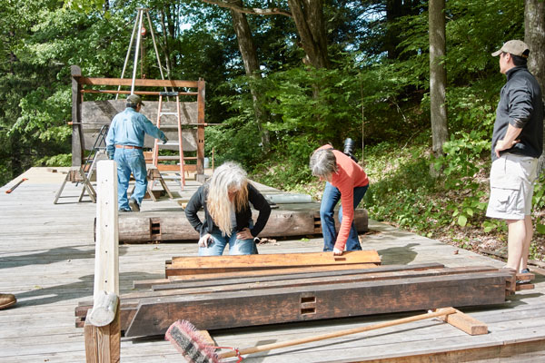 Reassembling "Reminiscence of Heirinji" on Toshio’s property. Toshio is in the background, his son, Shobu, is in the foreground, and Toshio's partner (and fellow artist) Laure Olender is with me in the middle, looking at the joinery.