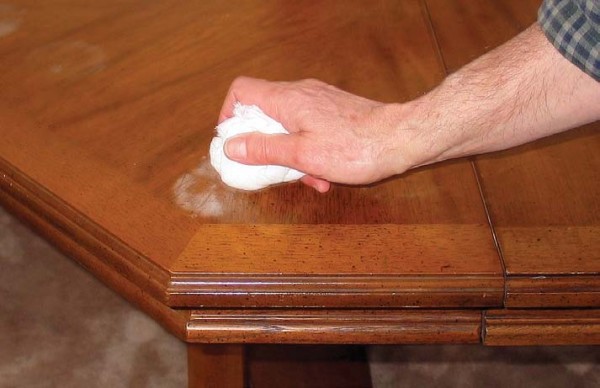 One method of removing white water marks (rings) is to wipe over with a lightly alcohol-dampened cloth. You’ll have more control if you fold the cloth into a pad, like a French-polish pad. Use only enough alcohol so you leave an evaporating trail resembling a comets tail as you wipe.